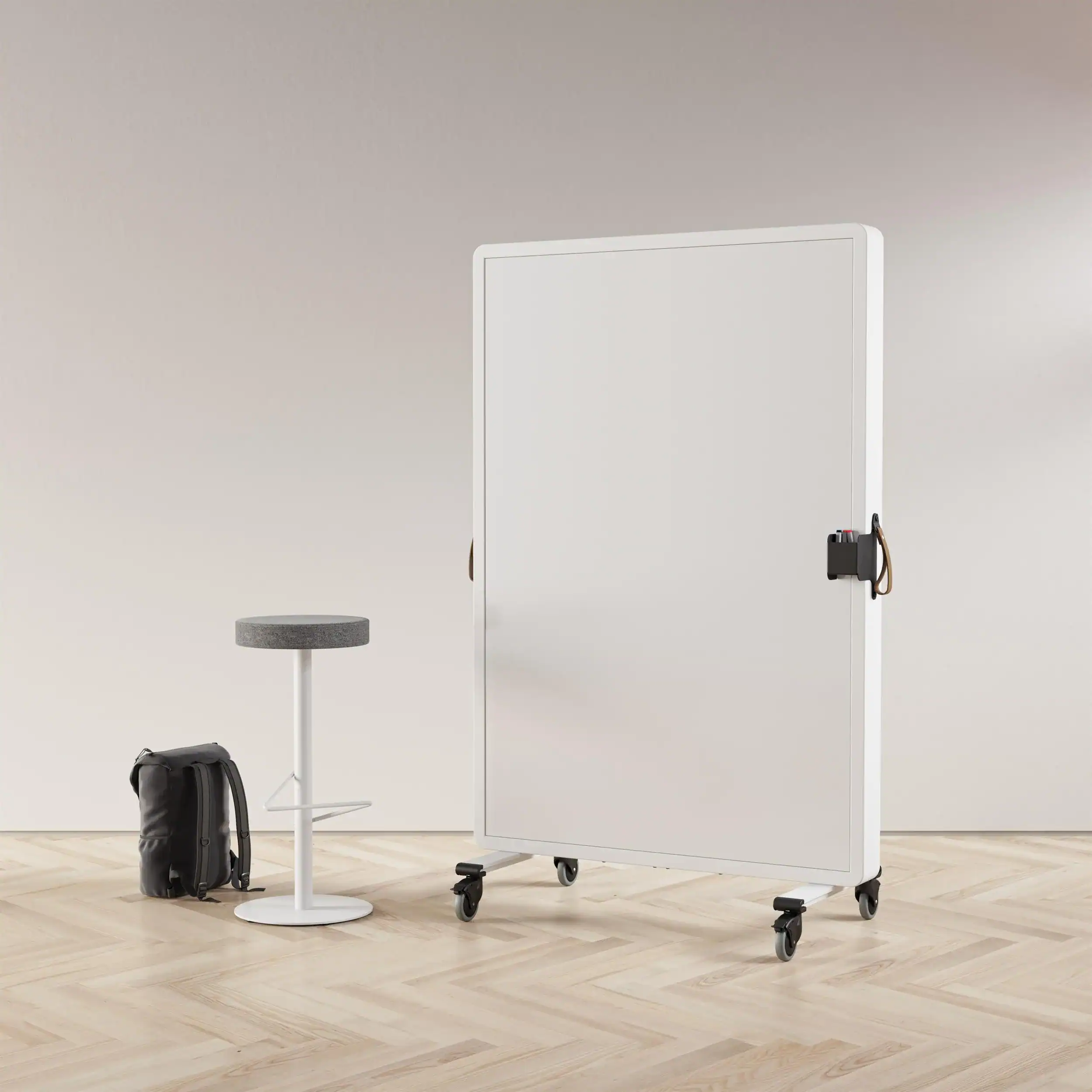 divider wall with a white baser stool with round grey seat pad, with a rucksack on the floor