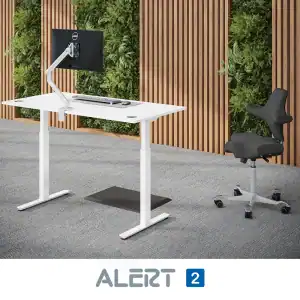 height adjustable desk with monitor arm and monitor and a chair