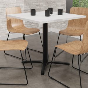 table with almond chairs around it